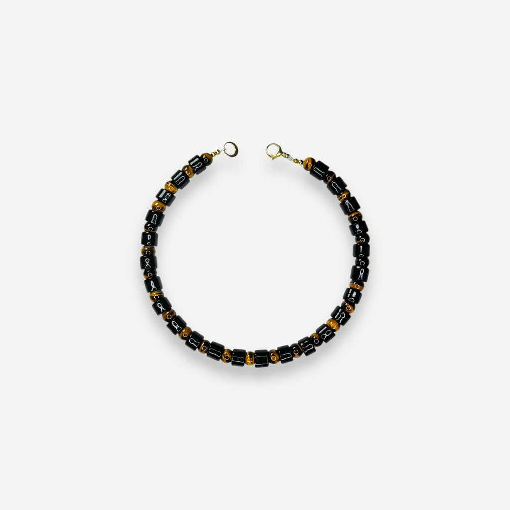 TAP & TIGERS EYE SUNDRY.  BEAD ONE.