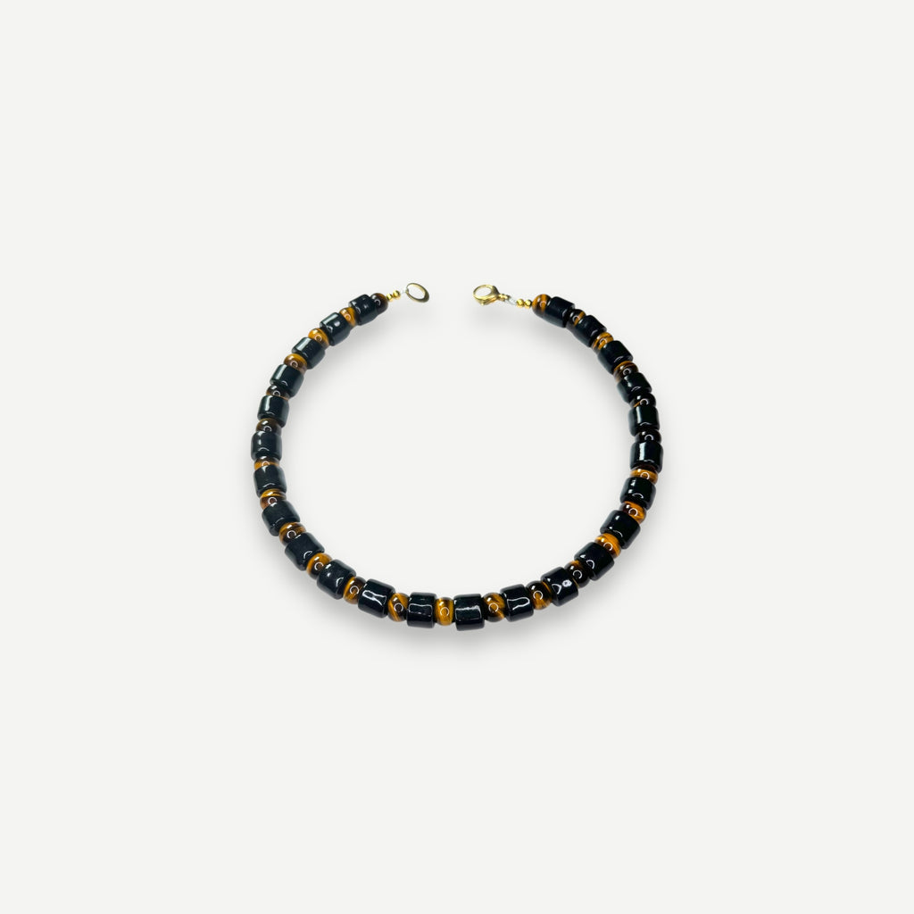 TAP & TIGERS EYE SUNDRY.  BEAD ONE.
