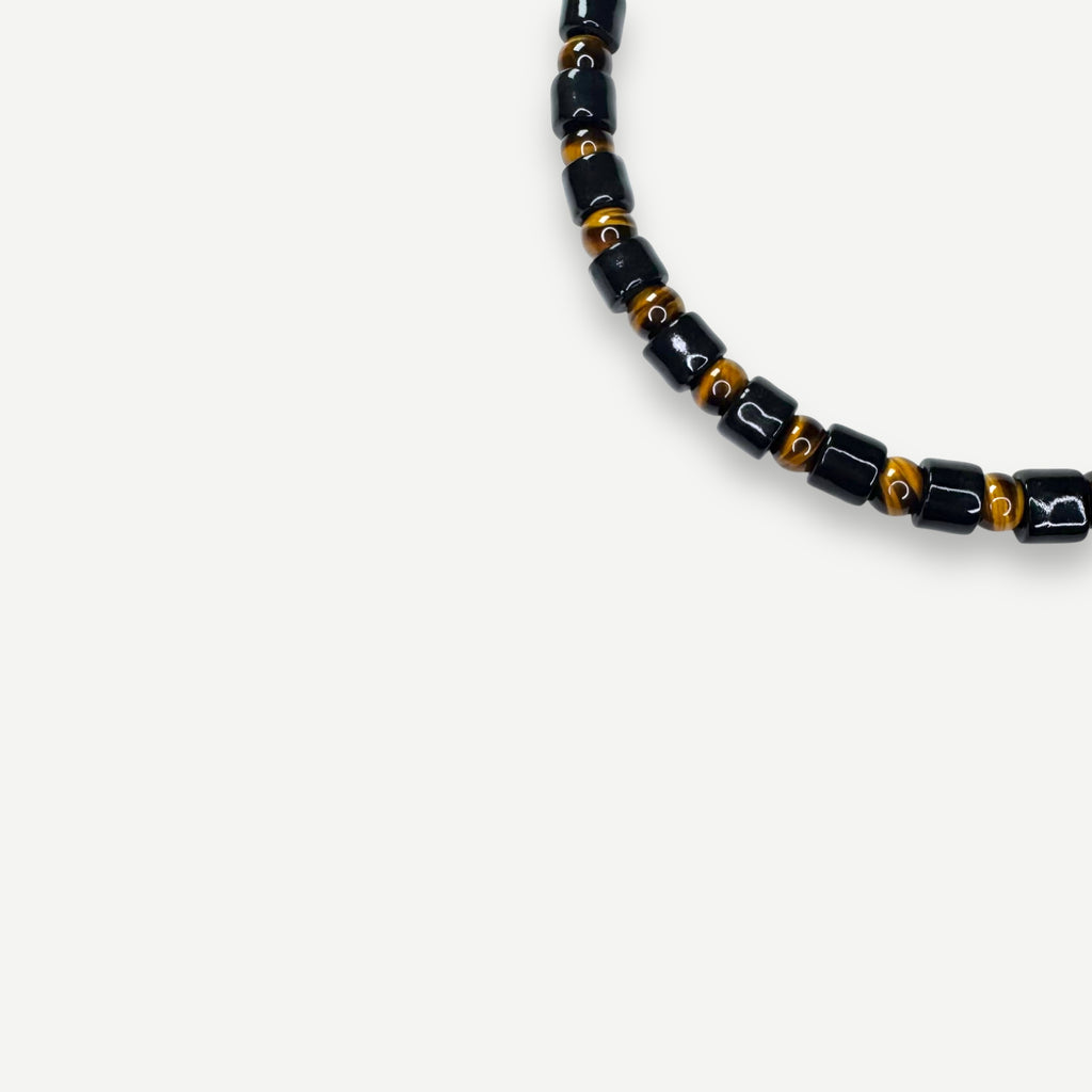 TAP & TIGERS EYE SUNDRY.  BEAD ONE.