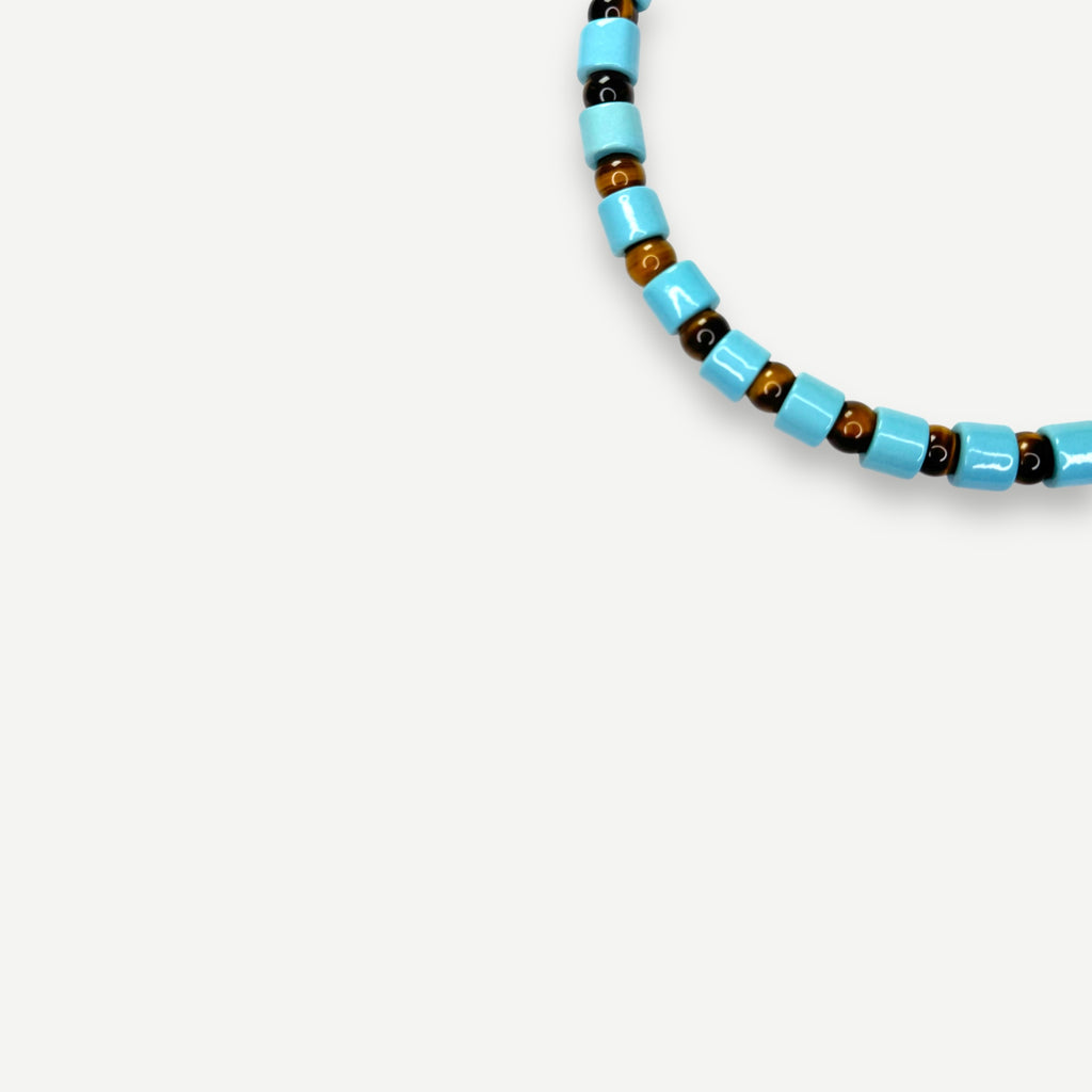 POOL & TIGERS EYE SUNDRY.  BEAD ONE.