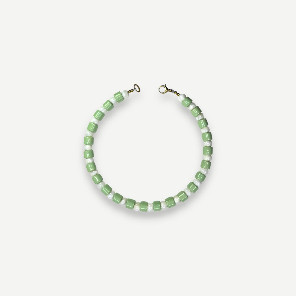 AMBROSIA & MOTHER OF PEARL SUNDRY.  BEAD ONE.