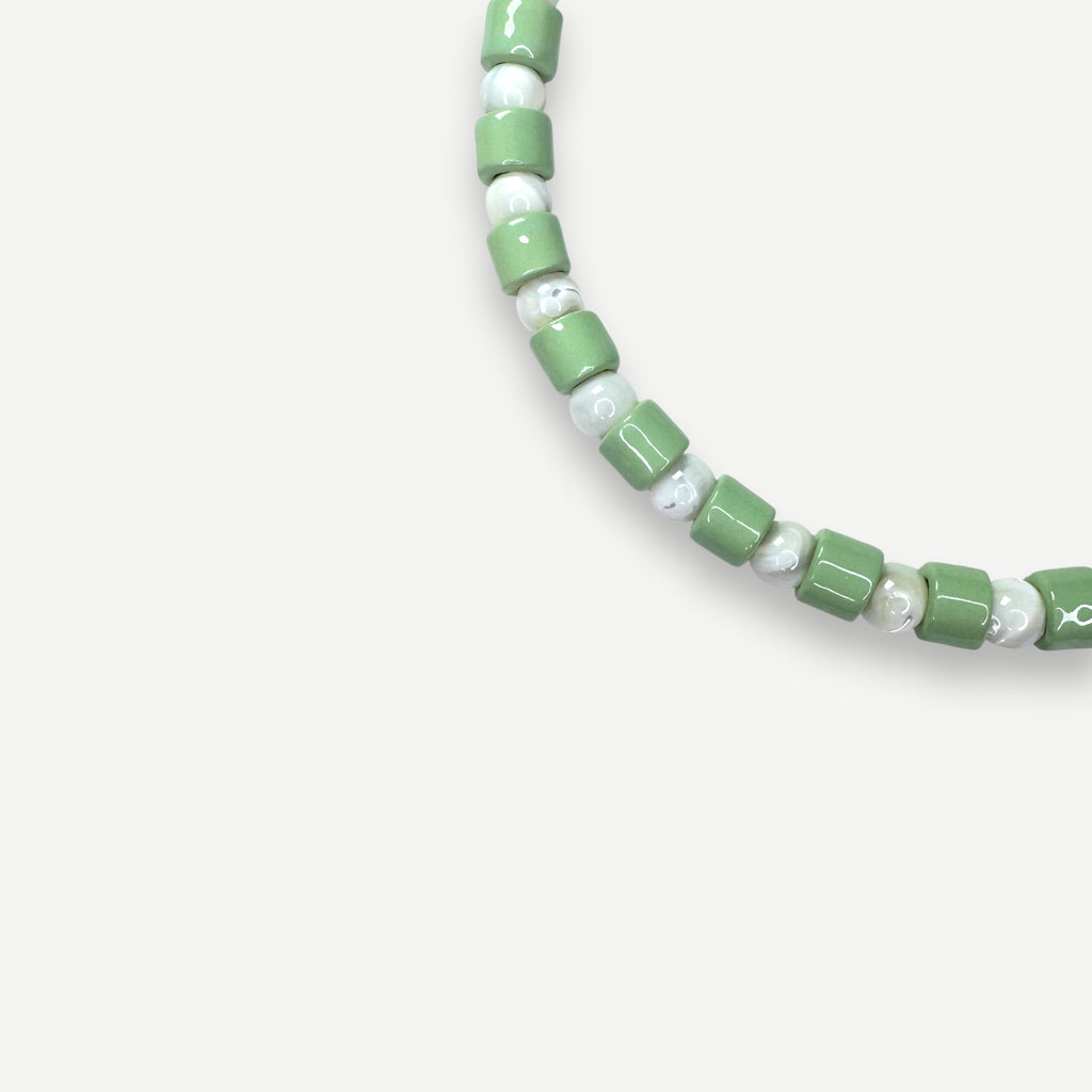 AMBROSIA & MOTHER OF PEARL SUNDRY.  BEAD ONE.