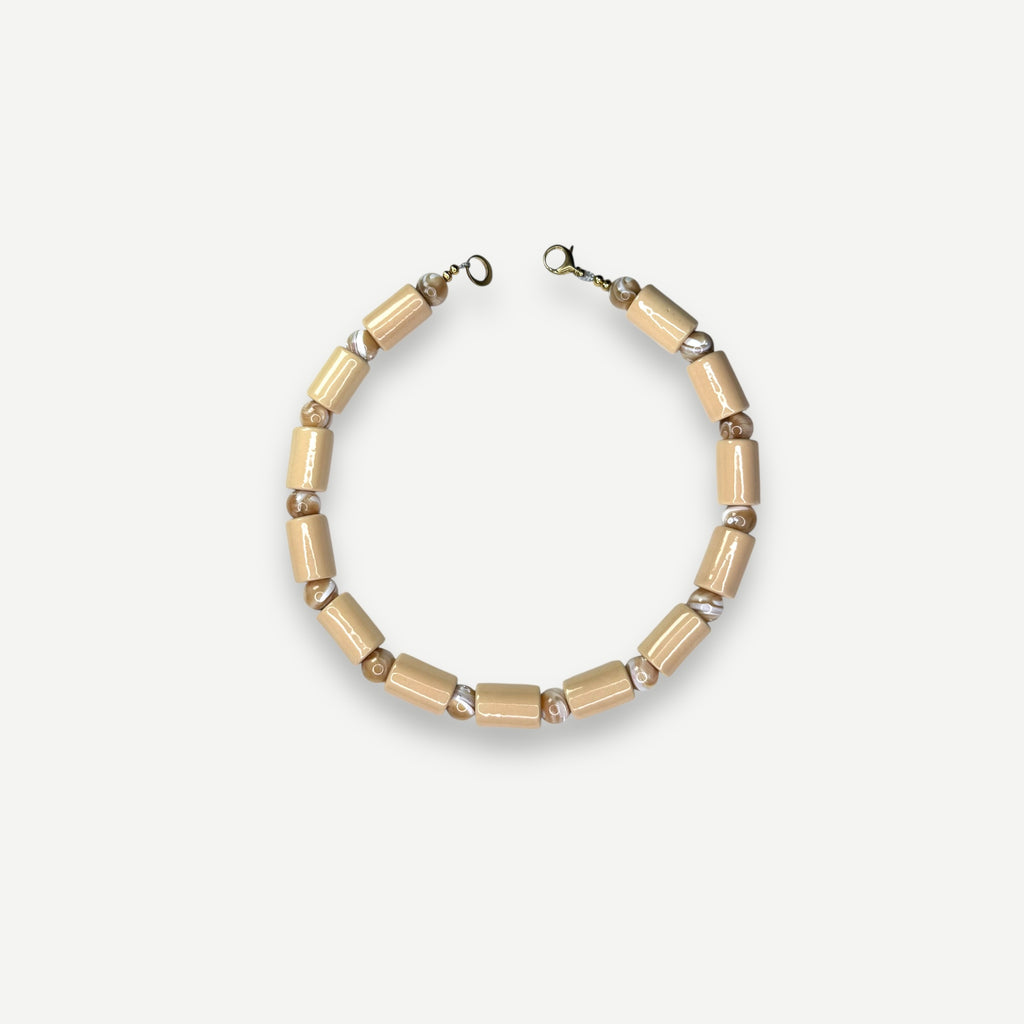 CREPE & CONCH MOTHER OF PEARL SUNDRY.  BEAD FIVE.