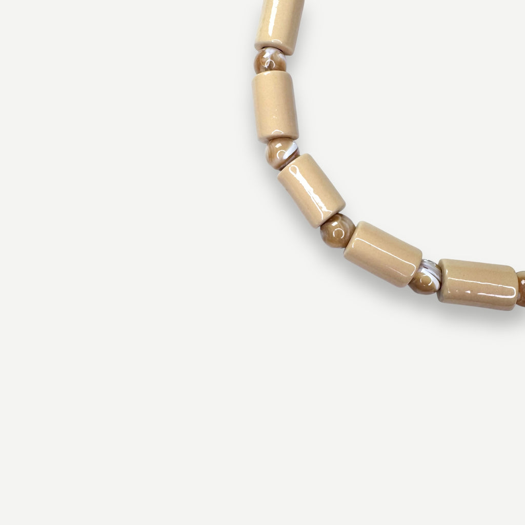 CREPE & CONCH MOTHER OF PEARL SUNDRY.  BEAD FIVE.