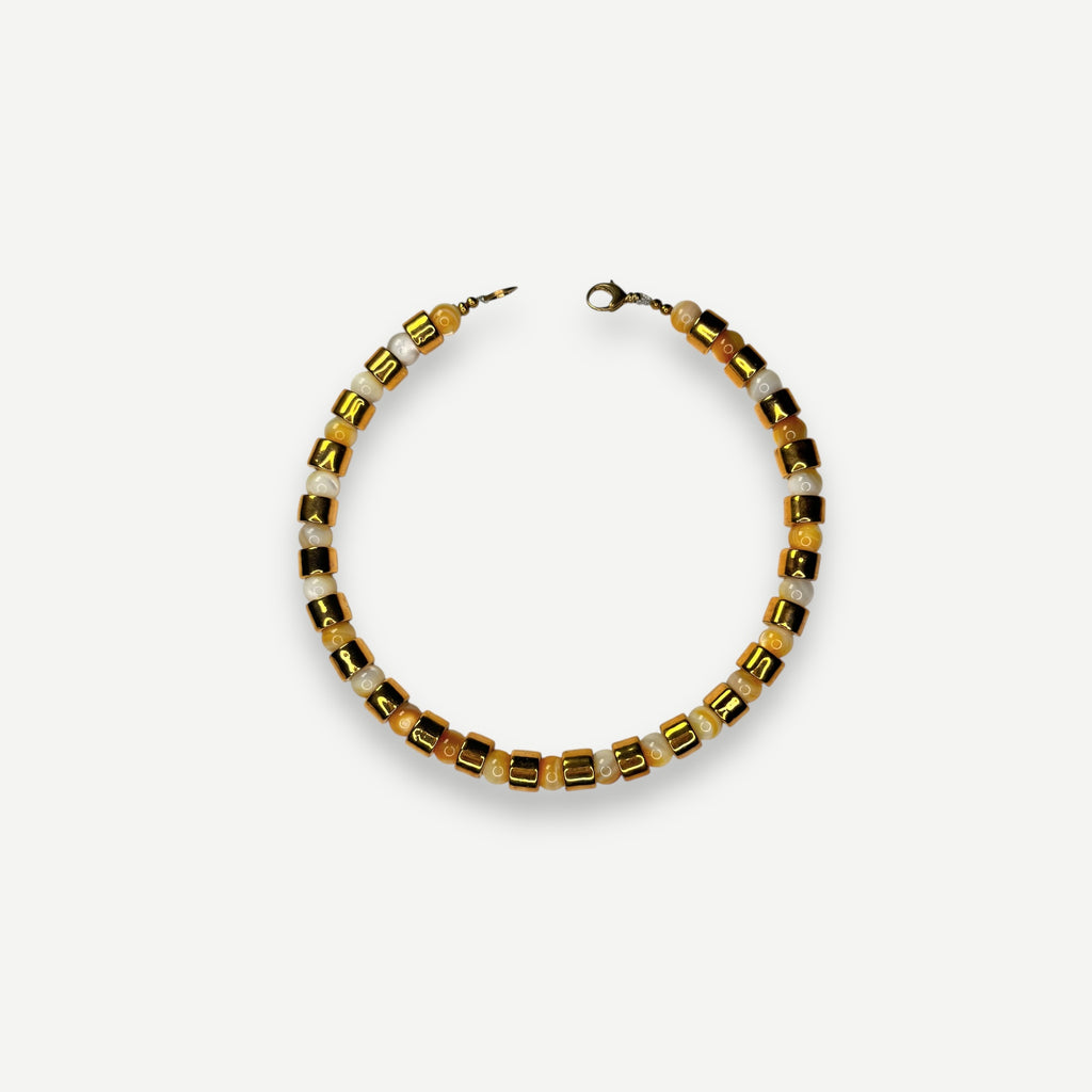 KARAT & BUTTERSCOTCH MOTHER OF PEARL SUNDRY.  BEAD ONE.