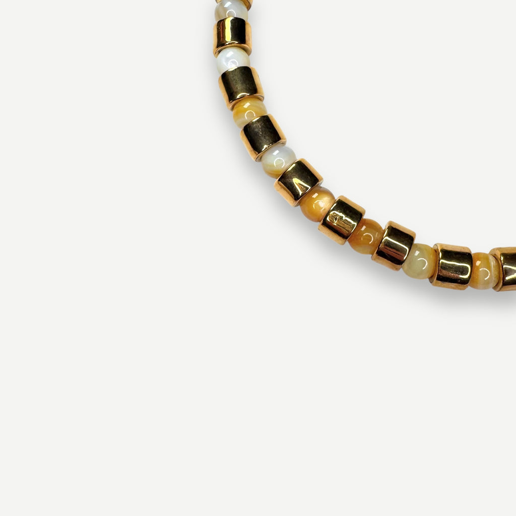 KARAT & BUTTERSCOTCH MOTHER OF PEARL SUNDRY.  BEAD ONE.