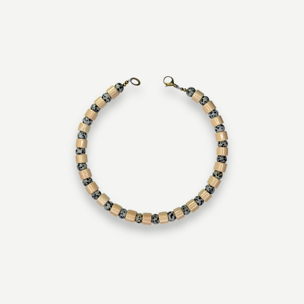 CREPE & DALMATIAN JASPER SUNDRY.  BEAD ONE.
