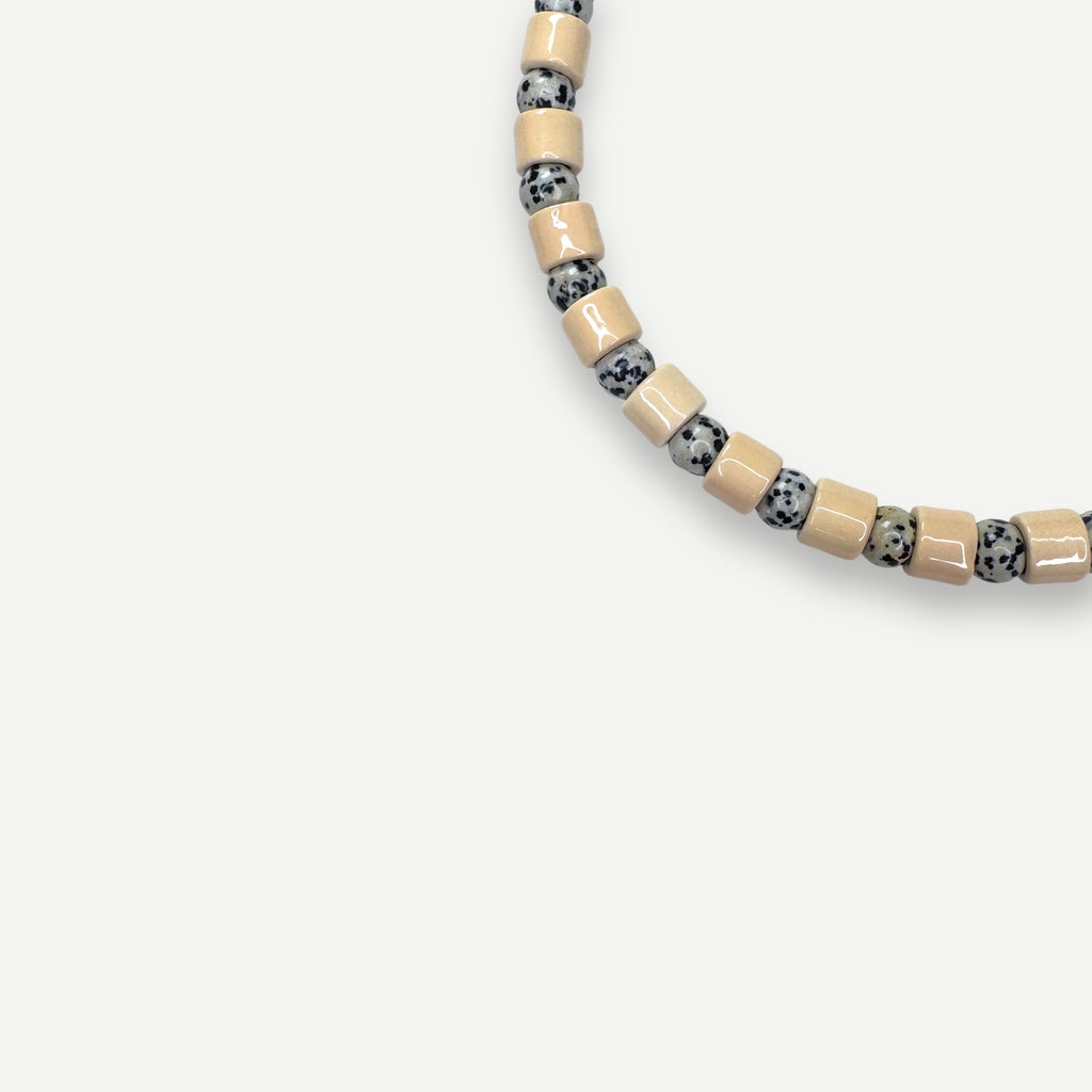 CREPE & DALMATIAN JASPER SUNDRY.  BEAD ONE.