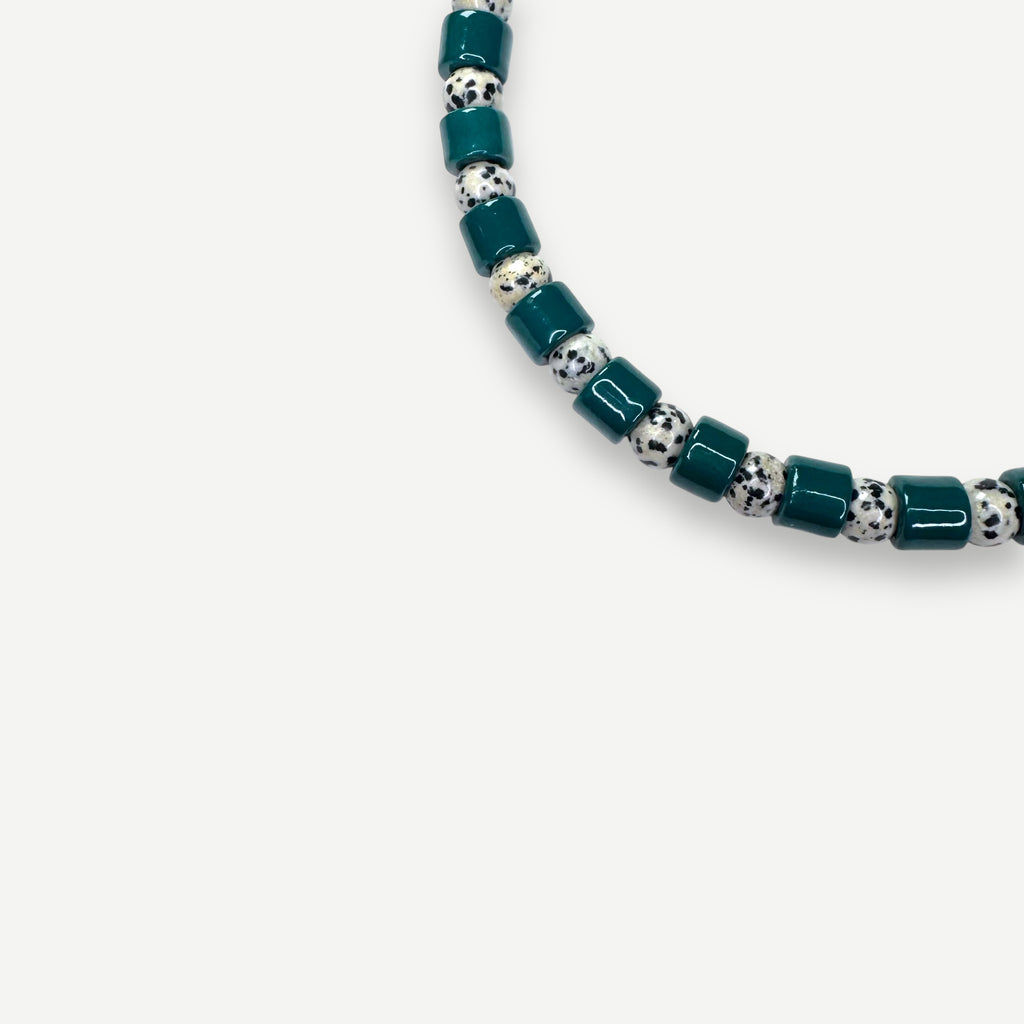 BOTTLE & DALMATIAN JASPER SUNDRY.  BEAD ONE.
